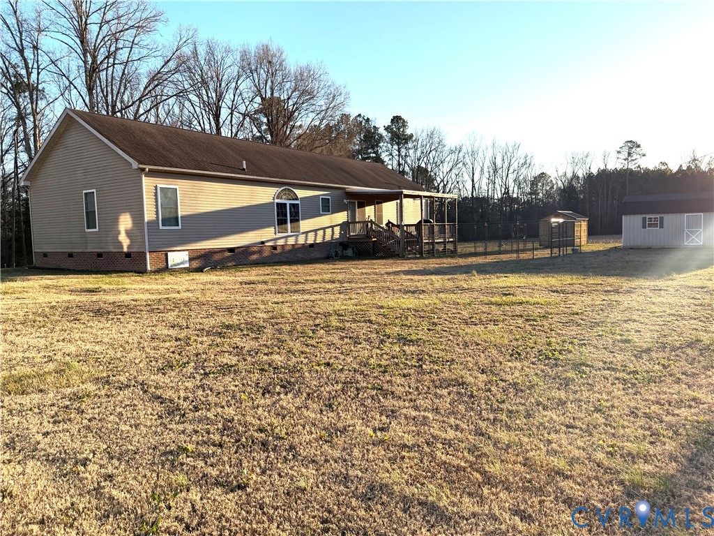 14558 Brick Road Petersburg, VA 23805 - Photo 27 of 27 View of side of home with crawl space, a yard, and