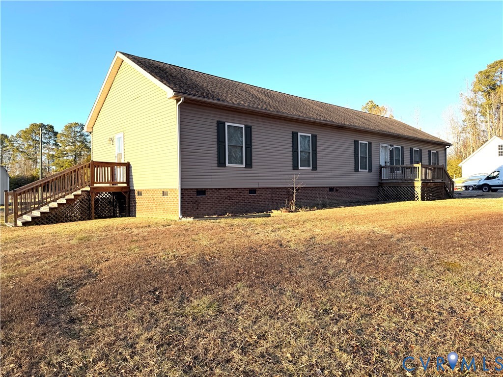 14558 Brick Road Petersburg, VA 23805 - Photo 3 of 27 View of side of home with crawl space, stairway, a