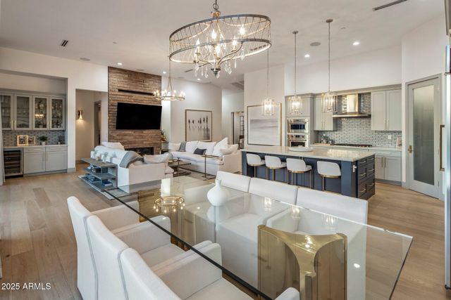 a living room with fireplace furniture and a flat screen tv