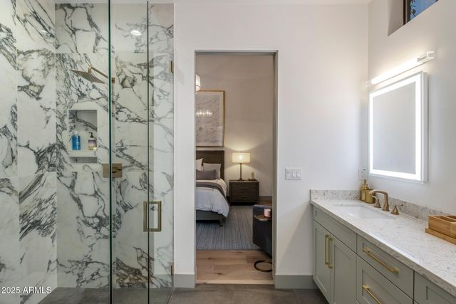a en suite bathroom with a sink and mirror