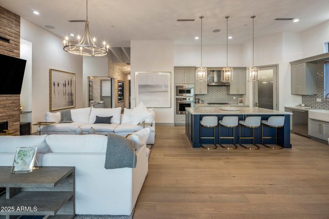 a large kitchen with a table and chairs