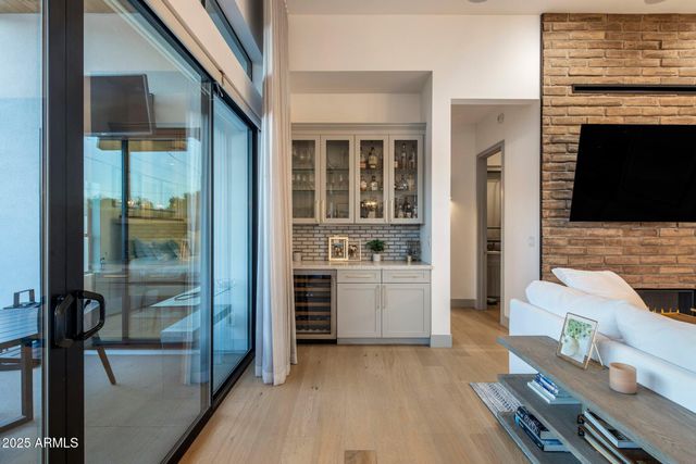 a room with a chair and a fireplace