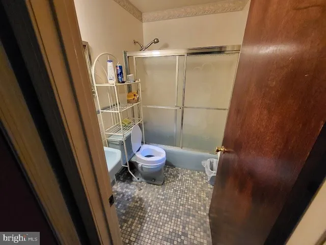 a bathroom with a sink and toilet