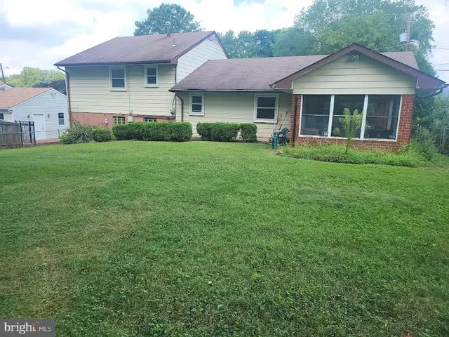 a view of a house with a yard and plants