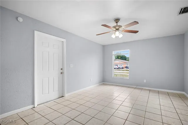 a view of an empty room and window