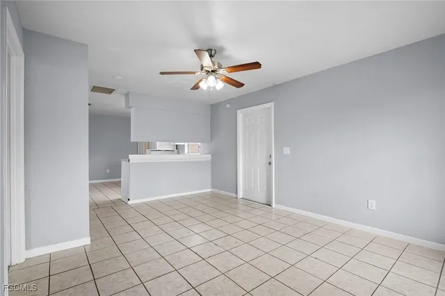 a view of a kitchen with marble top and white cabinet
