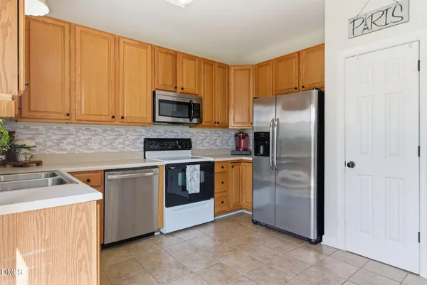 $329,500 | 241 Grand Pointe Drive, Unit 404, Garner, NC 27529