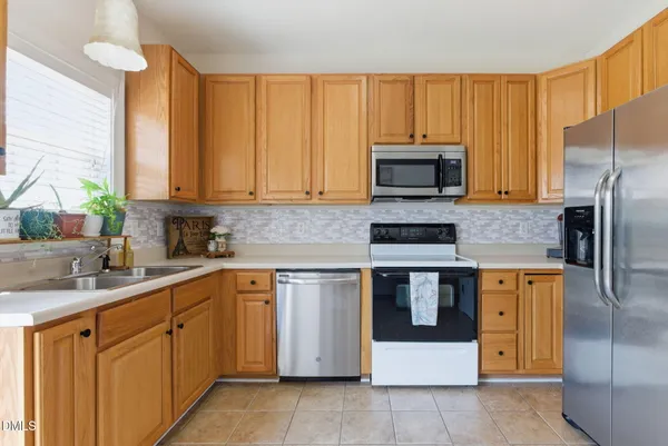 $329,500 | 241 Grand Pointe Drive, Unit 404, Garner, NC 27529