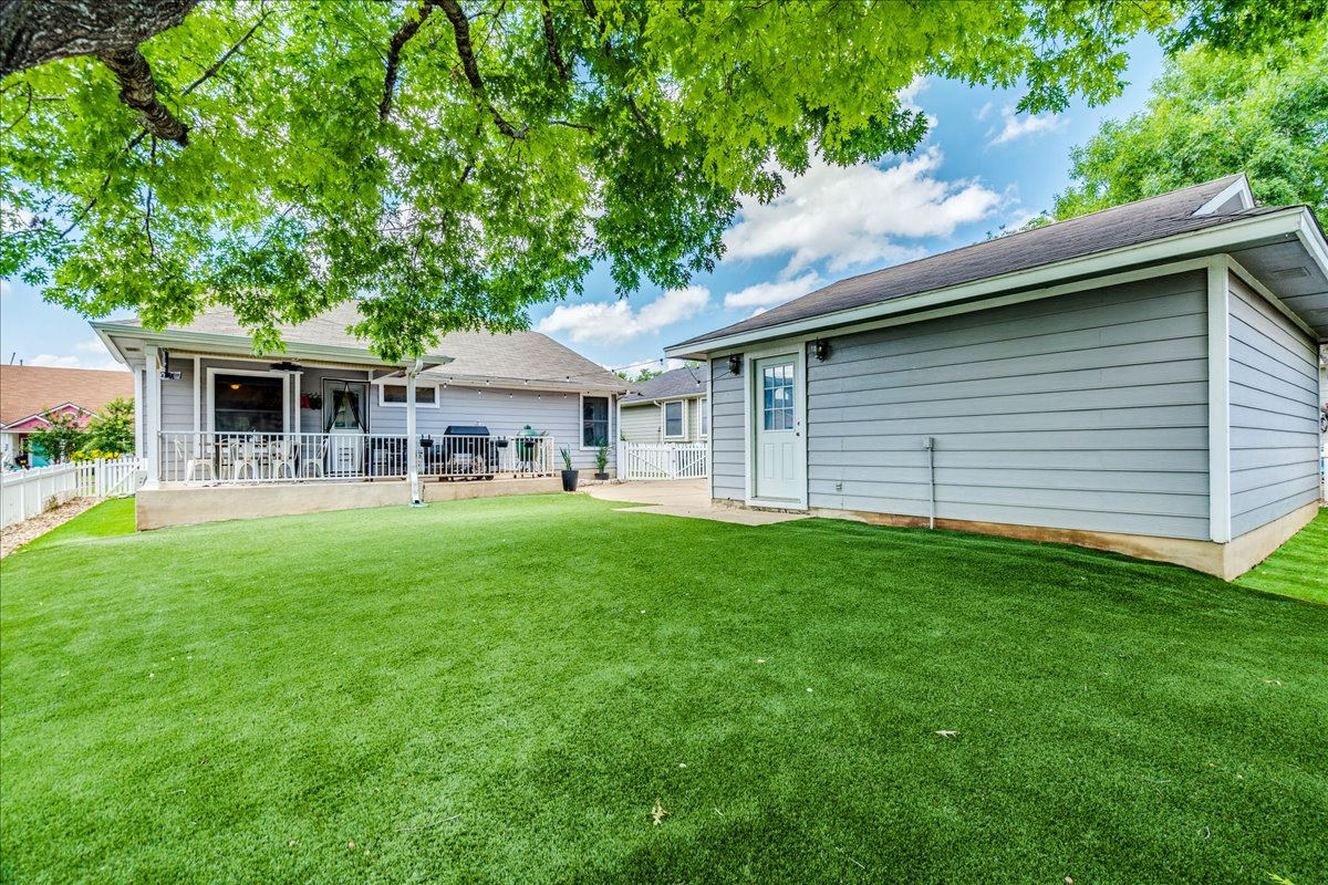 175 Wetzel Kyle, TX 78640 - Photo 27 of 27 A well-maintained lawn provides a verdant outdoor space, complemented by a welcoming patio perfect for gatherings.