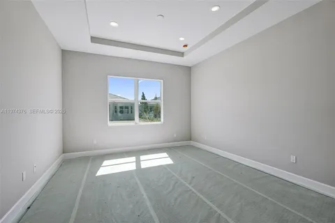 a view of a house with a snow in the yard