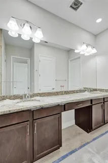 a view of a backyard with plants and palm tree