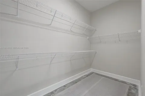 a view of a living room with furniture and a potted plant