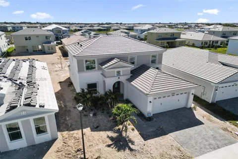 an aerial view of a house with outdoor space