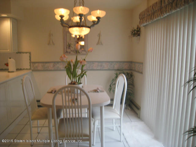 132 Beverly Road Staten Island, NY 10305 - Photo 14 of 38 Eating area with sliding doors to yard