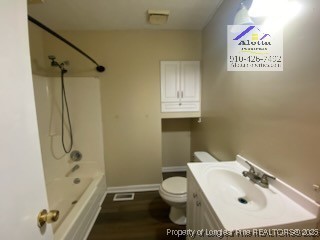 733 Goodyear Drive Spring Lake, NC 28390 - Photo 11 of 13 a bathroom with a sink toilet and shower