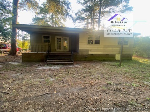 733 Goodyear Drive Spring Lake, NC 28390 - Photo 13 of 13 a front view of a house with a garden