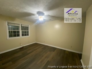 733 Goodyear Drive Spring Lake, NC 28390 - Photo 7 of 13 an empty room with a ceiling fan and window
