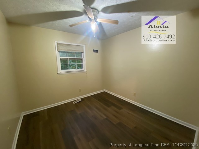 733 Goodyear Drive Spring Lake, NC 28390 - Photo 10 of 13 an empty room with a ceiling fan and window
