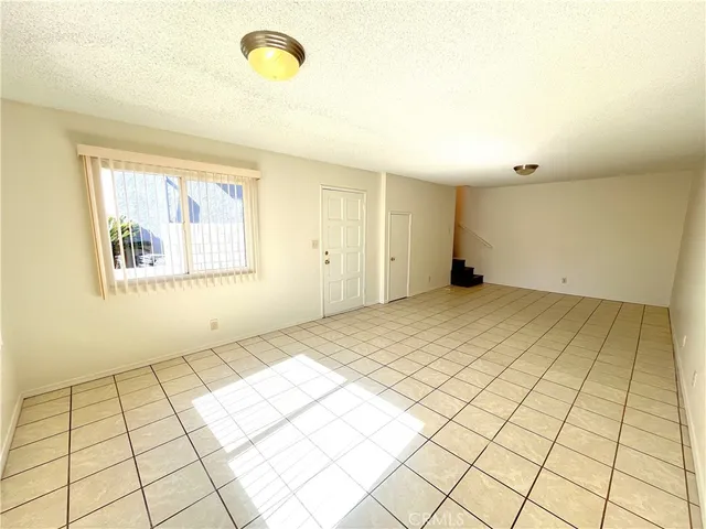 a large kitchen with a stove a sink dishwasher and a refrigerator