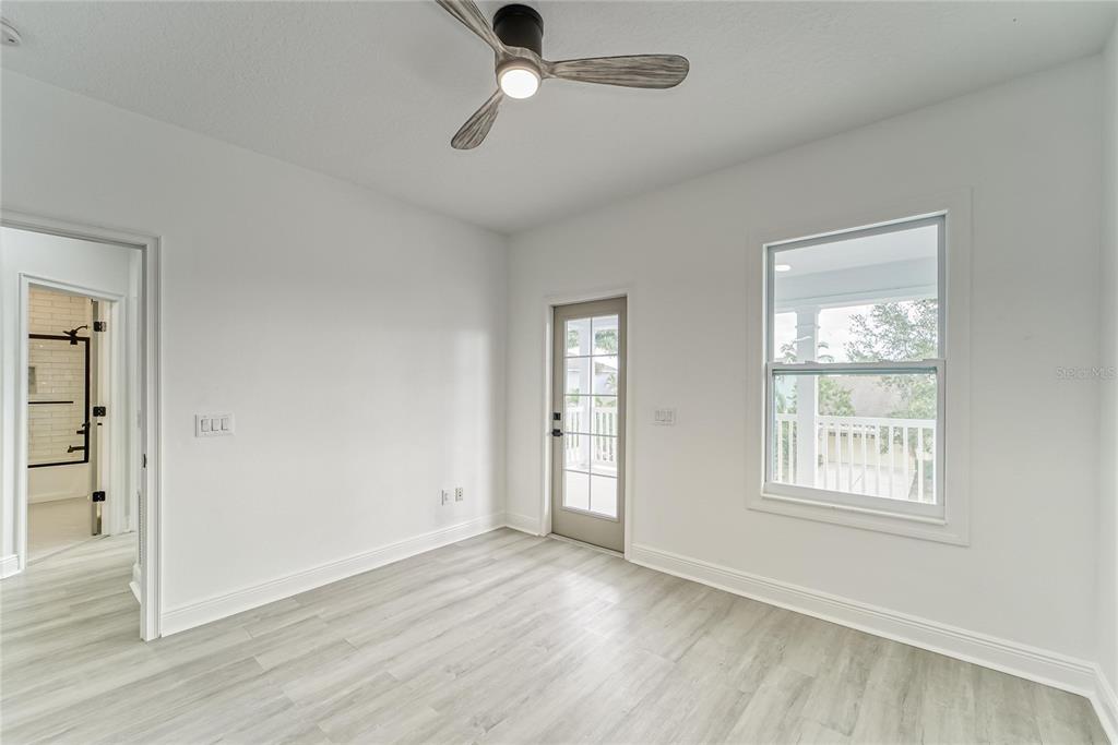 5718 Sea Turtle Place Apollo Beach, FL 33572 - Photo 17 of 81 wooden floor in an empty room with a window