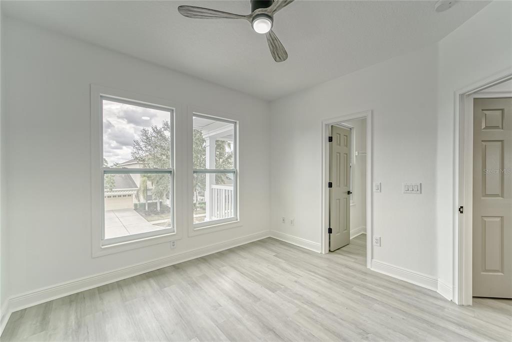 5718 Sea Turtle Place Apollo Beach, FL 33572 - Photo 20 of 81 a view of an empty room with a window and wooden floor