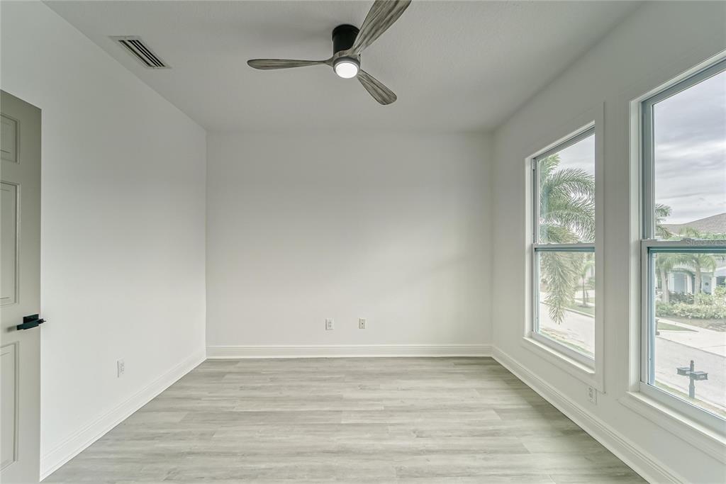5718 Sea Turtle Place Apollo Beach, FL 33572 - Photo 22 of 81 wooden floor in an empty room with a window