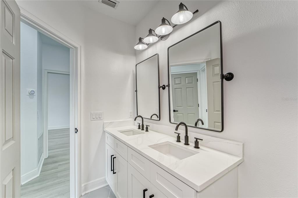 5718 Sea Turtle Place Apollo Beach, FL 33572 - Photo 25 of 81 a bathroom with a sink vanity and a mirror