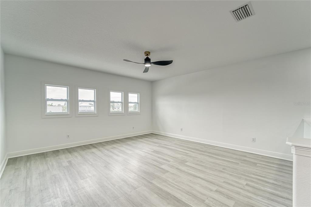 5718 Sea Turtle Place Apollo Beach, FL 33572 - Photo 26 of 81 wooden floor in an empty room with a window