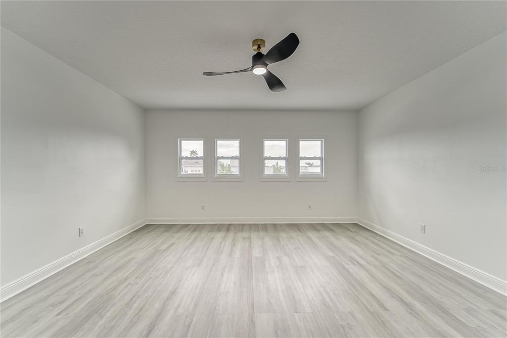 5718 Sea Turtle Place Apollo Beach, FL 33572 - Photo 27 of 81 wooden floor in an empty room with a window