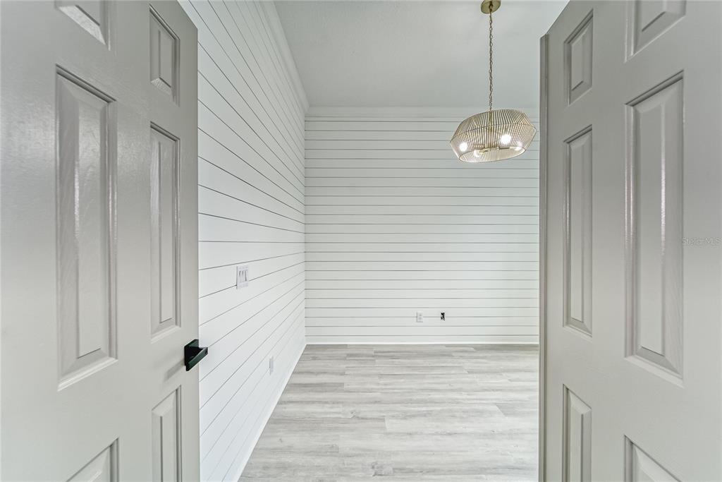 5718 Sea Turtle Place Apollo Beach, FL 33572 - Photo 33 of 81 a view of a hallway with wooden floor and staircase