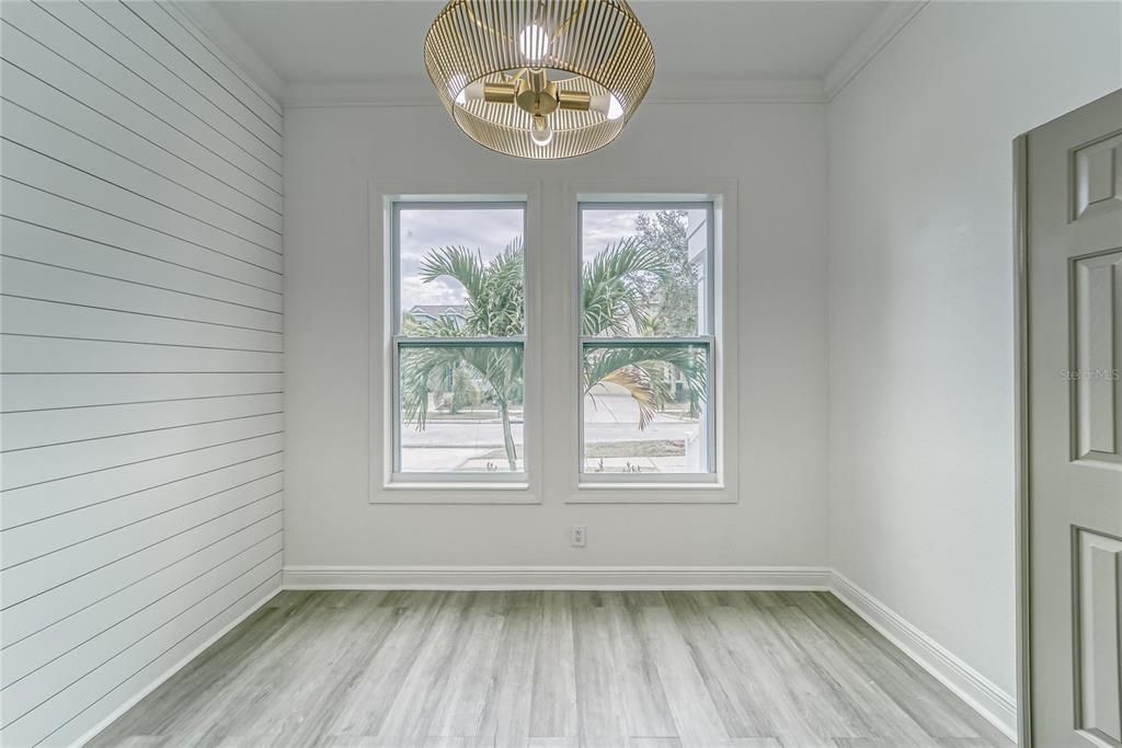 5718 Sea Turtle Place Apollo Beach, FL 33572 - Photo 35 of 81 an empty room with wooden floor and windows