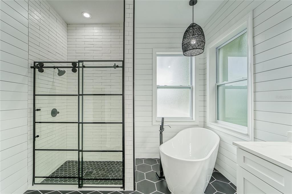 5718 Sea Turtle Place Apollo Beach, FL 33572 - Photo 46 of 81 a bathroom with a bathtub and shower