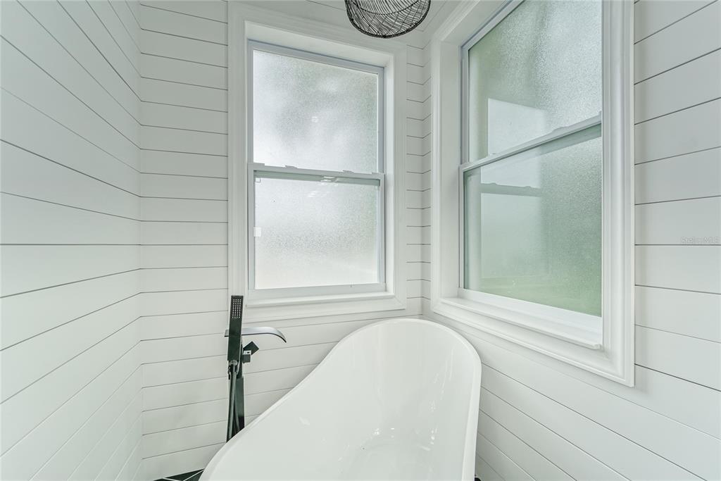 5718 Sea Turtle Place Apollo Beach, FL 33572 - Photo 47 of 81 a bathroom with a bathtub and a shower