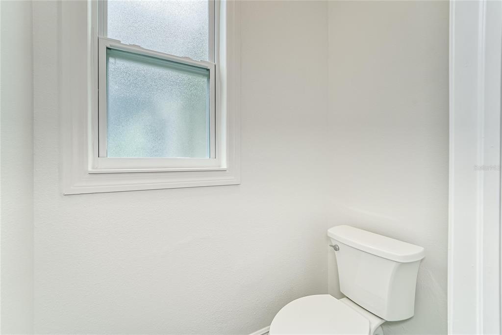 5718 Sea Turtle Place Apollo Beach, FL 33572 - Photo 49 of 81 a white toilet sitting next to a white tub