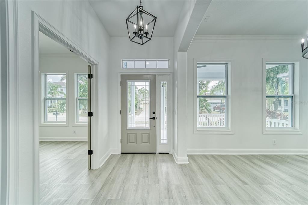 5718 Sea Turtle Place Apollo Beach, FL 33572 - Photo 57 of 81 an empty room with wooden floor and windows