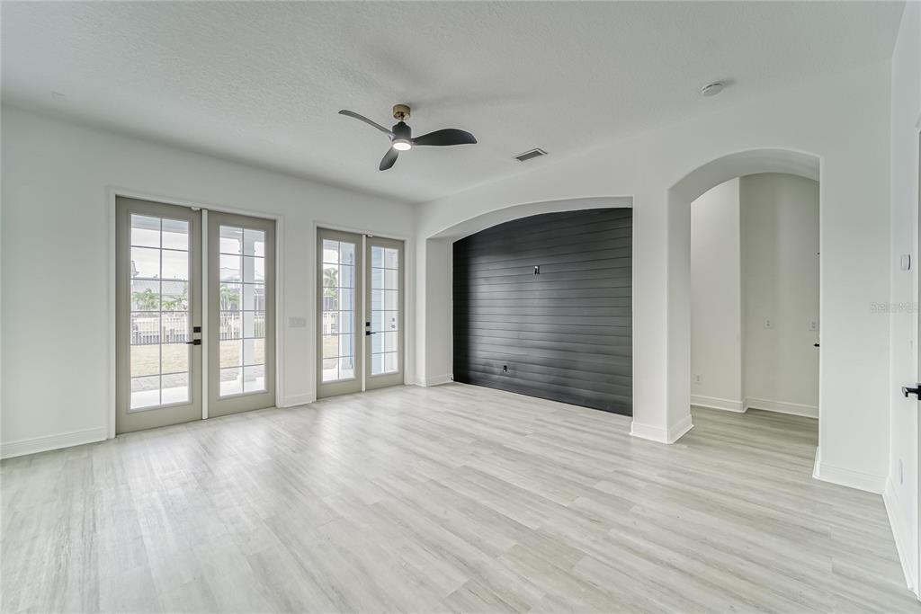 5718 Sea Turtle Place Apollo Beach, FL 33572 - Photo 61 of 81 a view of an empty room with wooden floor and a window