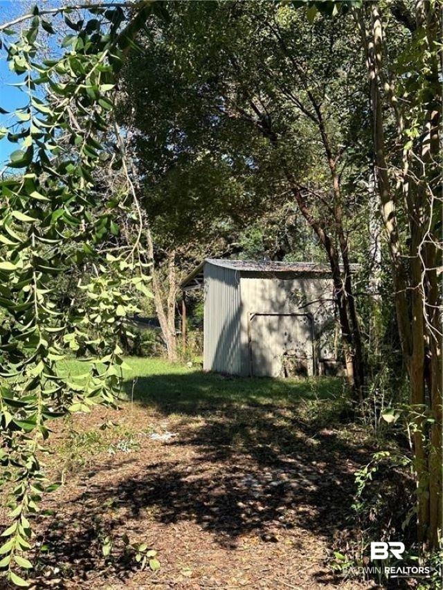 9151 Old Mobile Road Daphne, AL 36527 - Photo 19 of 23 View of yard with a shed