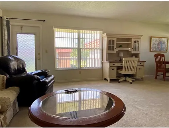 a room with furniture and a window