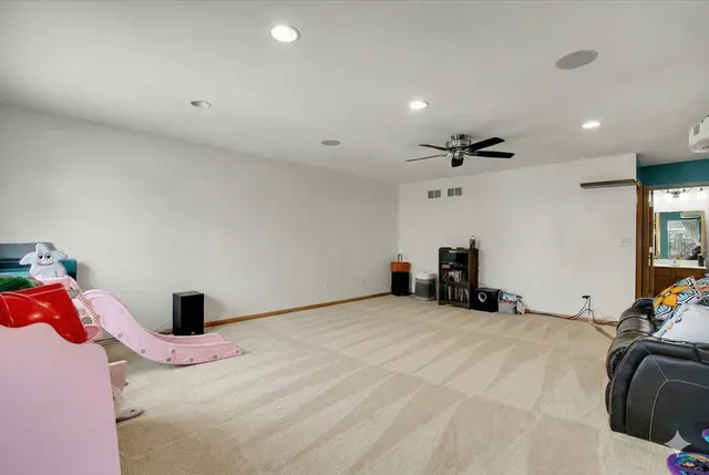 a bedroom with a bed and a large mirror