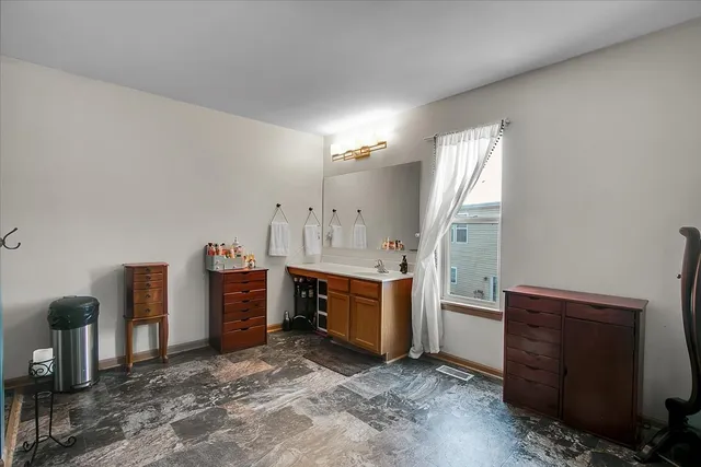 a view of a kitchen with refrigerator and stove