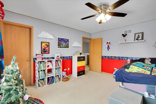 a view of a room with toys and a chandelier