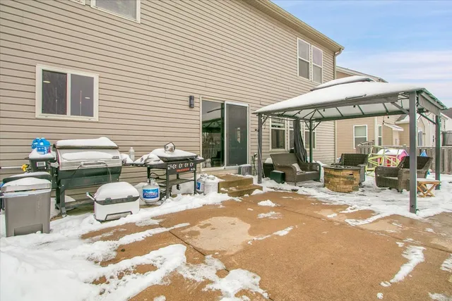 a view of a dinning tables and chairs in patio of the house