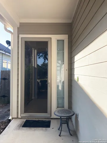 a room with a door and a table