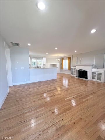 a view of a kitchen with microwave and cabinets