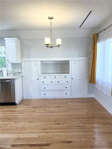 a view of a kitchen with sink microwave and stove
