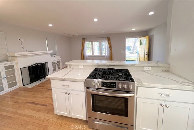 a view of a kitchen and kitchen with a sink
