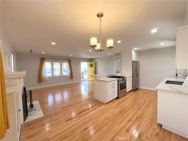 a kitchen with a stove oven and sink