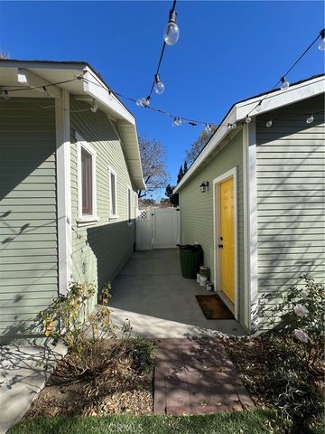 a backyard of a house with a tree