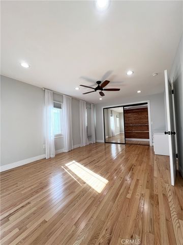 a view of room with wooden floor