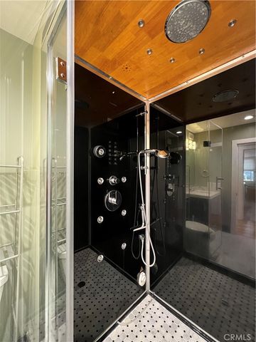 a kitchen with a sink and wooden floor
